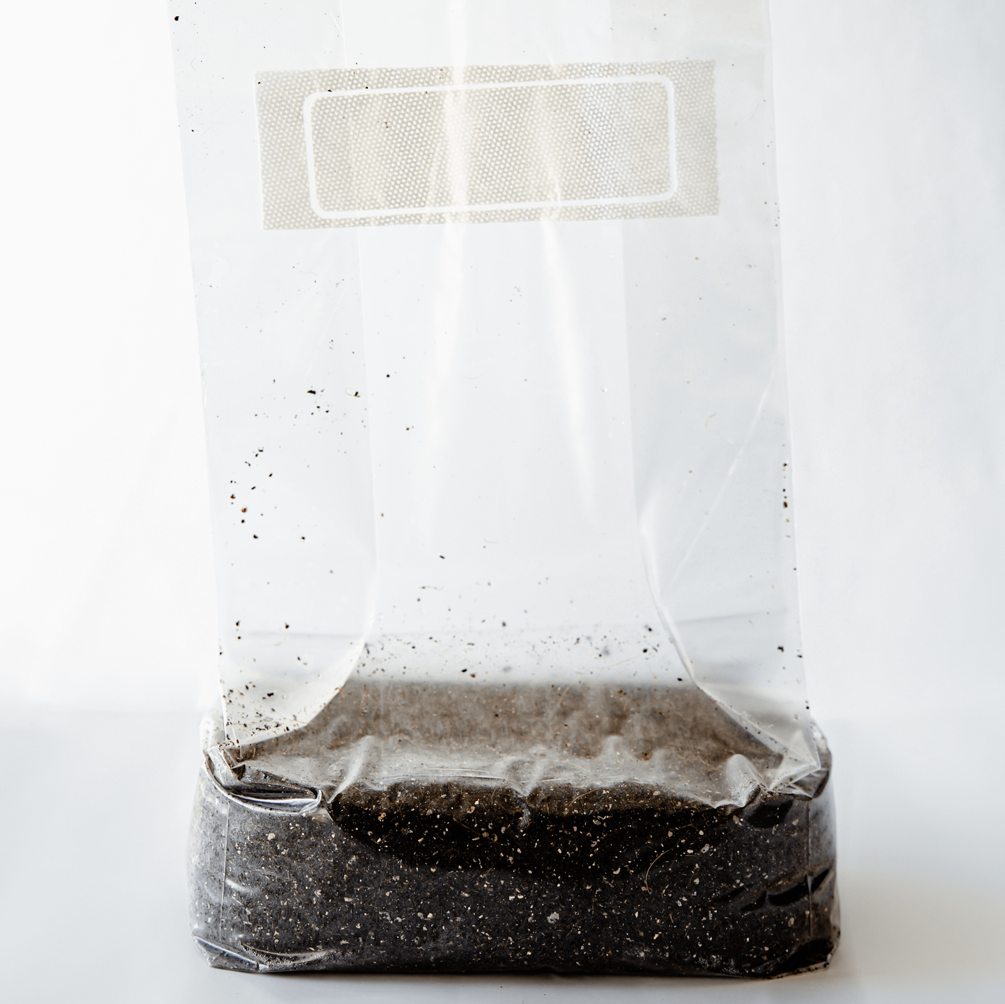 5lb bag of substrate standing up to show filter patch and contents of the bag