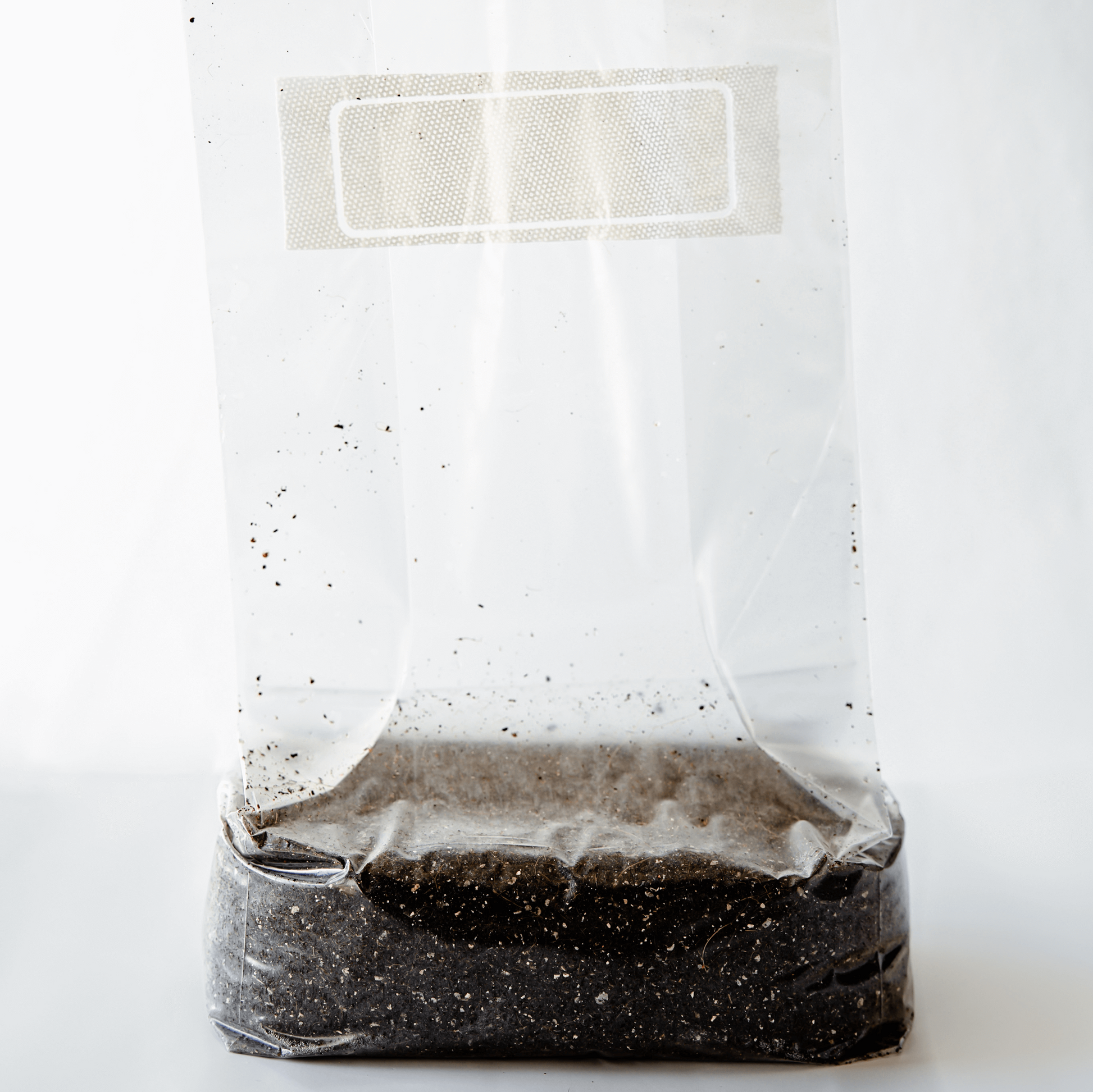 5lb bag of substrate standing up to show filter patch and contents of the bag