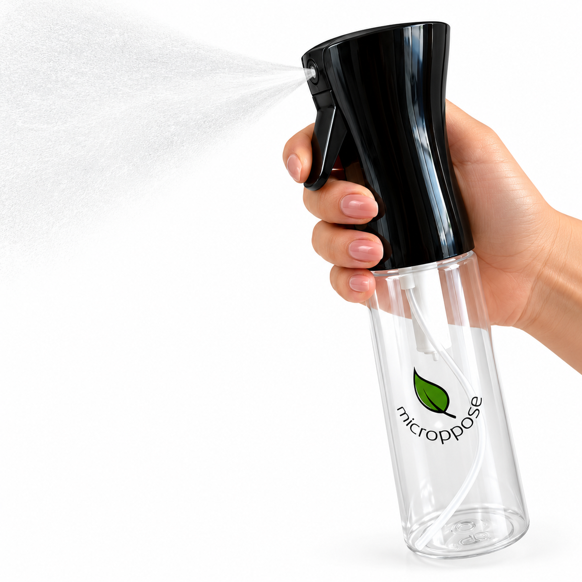 Hand holding a fine mist spray bottle